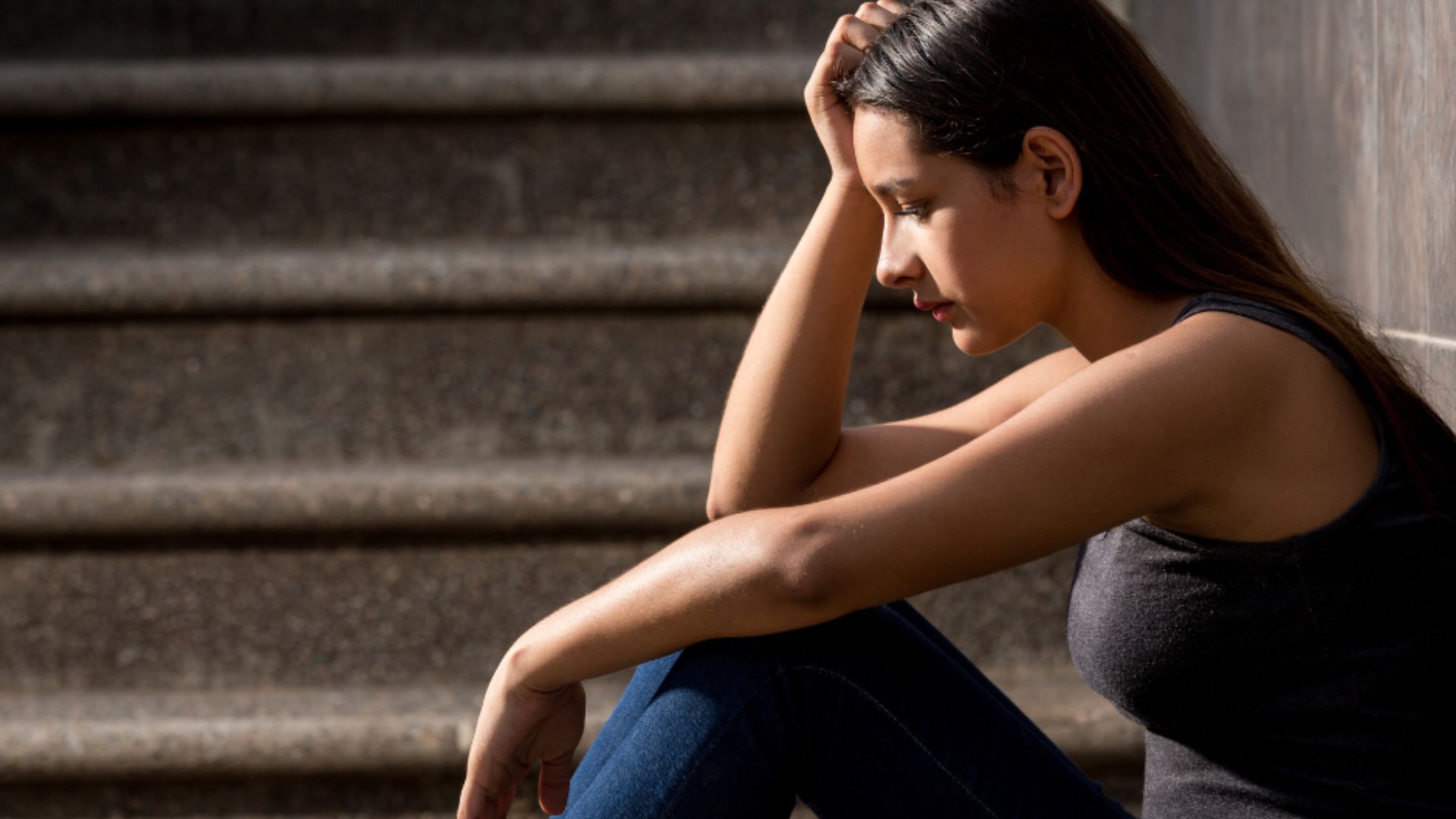 A Young Lady Sitting Looking Sad Showing How Do Human Trafficking Victims Recover